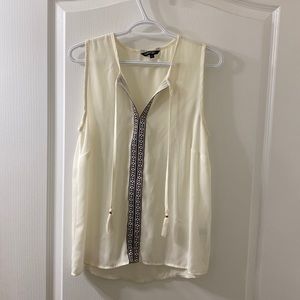 White George size medium blouse with tassels, and black and red strip